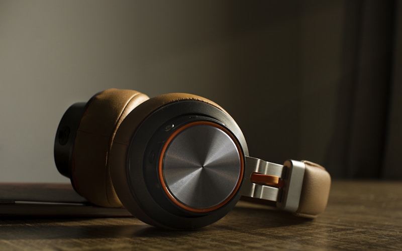 Gas engineer inspecting boiler in British utility room, homeowner watching, cold winter light